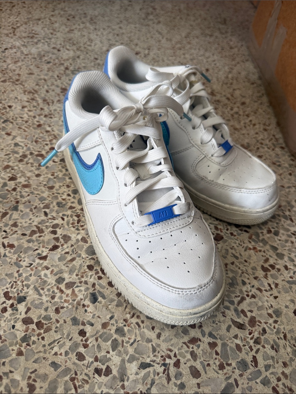 Nike Kids White Sneakers with Light Blue Swoosh